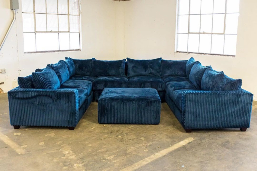 Blue U-shaped sectional made by Living Designs Furniture