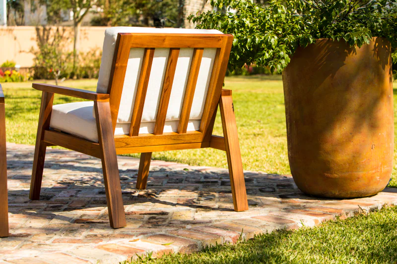 Back view of teak wood patio furniture by Living Designs Furniture
